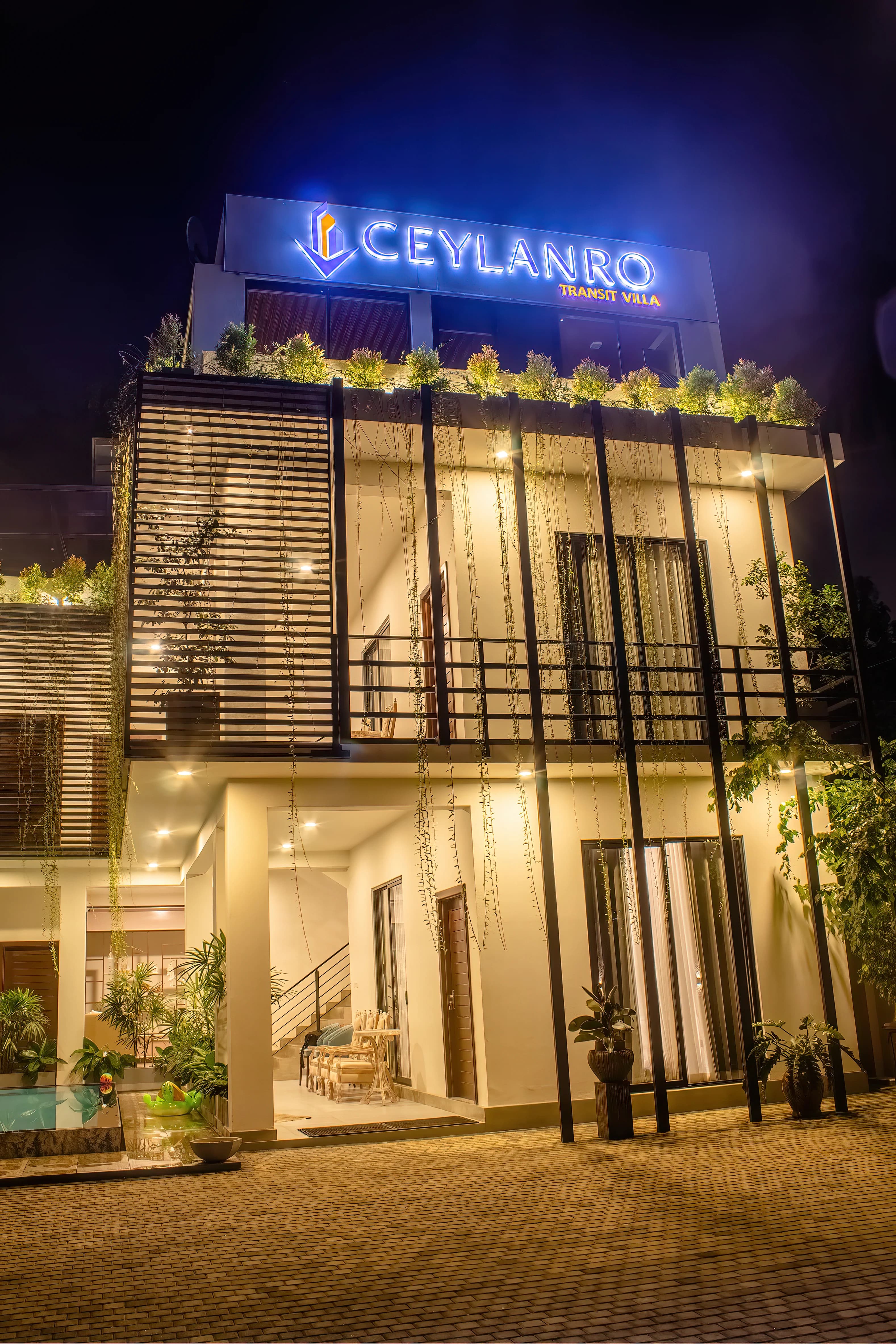 Illuminated Villa Facade at Night